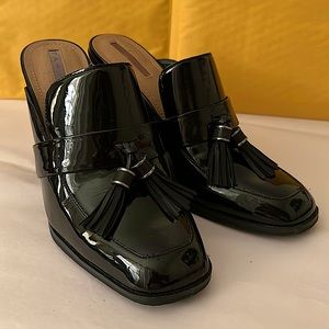 Tahari preppy mules in black patent leather.